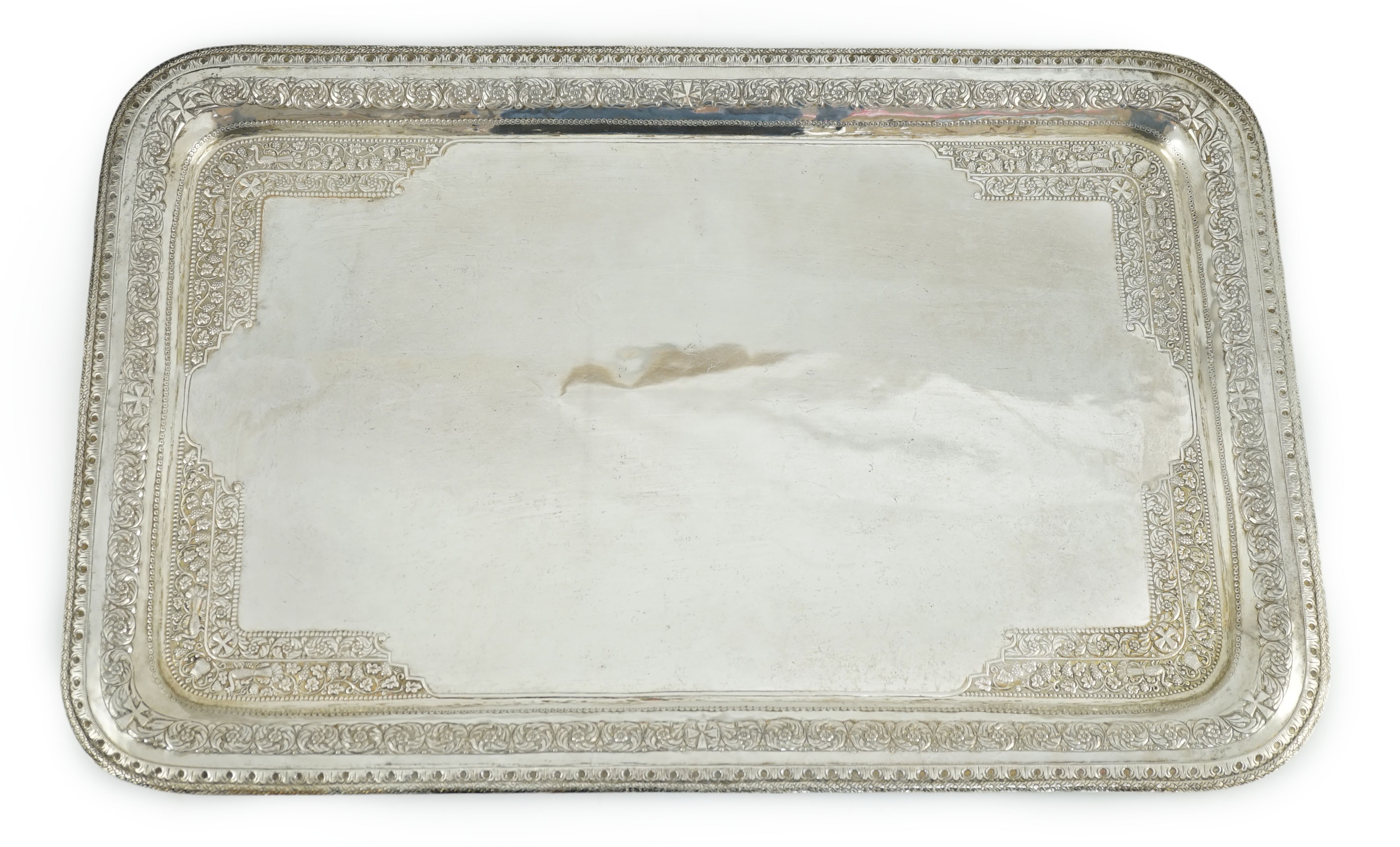 A 20th century Indian white metal rounded rectangular tea tray